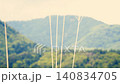 山巒景色，枯萎的草枝在風中搖曳：宛如電影畫面。 140834705