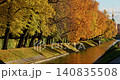 Lebyazhya kanavka embankment to the engineering palace, Trees with yellow leaves of the Summer garden in sunny autumn evening, Russia, Saint Petersburg 140835508