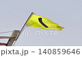 Yellow flag on the beach in summer summer, lifeguards sign to bathe carefully 140859646
