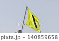 Yellow flag on the beach in summer summer, lifeguards sign to bathe carefully 140859658