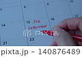 Job interview text in red, written on desk calendar. Employment or careers concept. 140876489