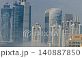 Dubai skyscrapers in fog morning timelapse Business Bay urban cloud blanket 140887850