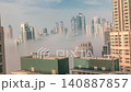 Dubai skyscrapers in fog morning timelapse Business Bay flat building roofs 140887857