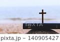 Background of a church summer retreat, summer Bible school, and summer camp featuring the sound of cool waves, the sea, a sandy beach, a Bible, and a cross. 140905427