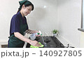 House cleaning staff cleaning the gas stove 140927805