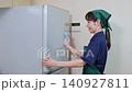 House cleaning staff cleaning the refrigerator 140927811