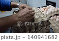 Quality Inspection of Fresh Chicken Eggs by Worker Wearing Protective Gloves 140941682