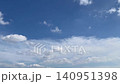 A beautiful video with a clear blue summer sky and moving clouds as the background. 140951398