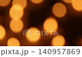 Warm amber bokeh lights drifting in soft abstract defocused view 140957869