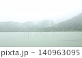 Lake and rain 140963095