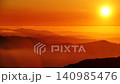 Burning sunset in high mountains above clouds 140985476