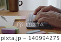 Men using a wireless keyboard Men using a wireless keyboard 140994275