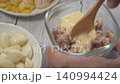 Mix tuna and mayonnaise with a spoon to make tuna mayo. Mix tuna and mayonnaise with a spoon to make tuna mayo. 140994424