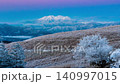 A panoramic view of Mount Ontake bathed in pink light from the Kirigamine Plateau at dawn ← Slide to the left 140997015
