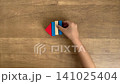 A 4K silent slow-motion video showing the fourth piece in a series of building fish shapes with building blocks. 141025404