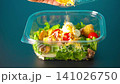 Prepare lunch chicken salad for work in plastic containers. Healthy food. Cheese 141026750