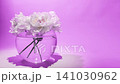flowers in a vase on a purple background, calm and elegant display front view, home decor, wedding event decoration, natural light, clean space, modern design, vivid colors, serene and warm. 141030962
