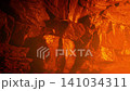 Fire Glowing And Smoking By Cave Wall 141034311
