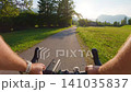 POV of cyclist riding on asphalt bike path. First person view 141035837