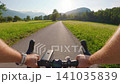 POV of cyclist riding on asphalt road bike path in Slovenia 141035839