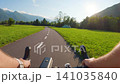 POV of cyclist riding on asphalt road bike path in Slovenia 141035840