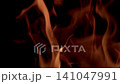 Dynamic and vivid flames are gracefully dancing and flickering in the darkness of the night sky Dynamic and vivid flames are gracefully dancing and flickering in the darkness of the night sky 141047991