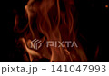 Dynamic Flames Gracefully Dancing in the Embracing Darkness of the Night Sky Above Us Dynamic Flames Gracefully Dancing in the Embracing Darkness of the Night Sky Above Us 141047993