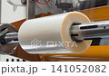 Clear film wrapping process in a packaging factory in day time 141052082