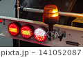 Flashing lights on a work vehicle during safety inspection at a construction site 141052087