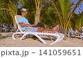 Businessman at vacation working on beach with a 141059651