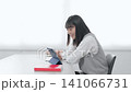 Female student studying using a tablet PC 141066731