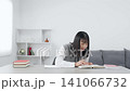 Female student studying in the room 141066732