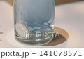Effervescent tablet dissolving in water with a dental retainer 141078571
