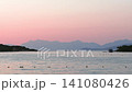 Sunset over the Albanian Riviera with calm sea and mountain silhouette 141080426