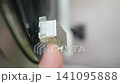 Lowering/lifting the needle on a record player with your finger 141095888