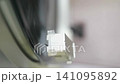 Listening to analog records on a record player 141095892