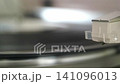 Listening to analog records on a record player 141096013