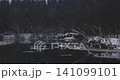 Dark Moody Winter Landscape With Frozen River and Snowy Forest Dark Moody Winter Landscape With Frozen River and Snowy Forest 141099101
