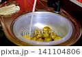 Fresh young potatoes washed in basin under running water inside kitchen sink before homemade cooking creating clean food preparation close up food video 141104806