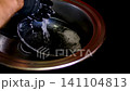 New stainless steel pan washed with sponge soap and running water before first use by hands in black gloves kitchen cleaning video set 141104813