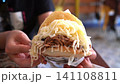 Arepa Perua, a hugely popular national dish of Venezuela, is a corn flour bread overflowing with various toppings. 141108811