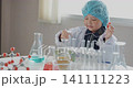 Asian girl experimenting with chemistry in the laboratory, Elementary school children learning science. 141111223