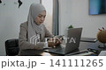 Islamic woman using mobile phone in office. Business woman working at the company, internet communication 141111265