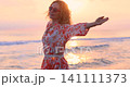 Happy young woman having fun at the beach. Slow motion 141111373