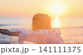 Happy young woman having fun at the beach. Slow motion 141111375