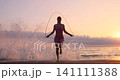 Happy young woman doing sport at the beach. Slow motion 141111388