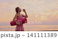 Happy young woman doing sport at the beach. Slow motion 141111389