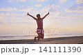 Happy young woman doing sport at the beach. Slow motion 141111390