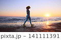 Happy young woman doing sport at the beach. Slow motion 141111391