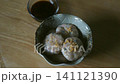 A delicious and artfully presented steamed baby bamboo dumplings 141121390